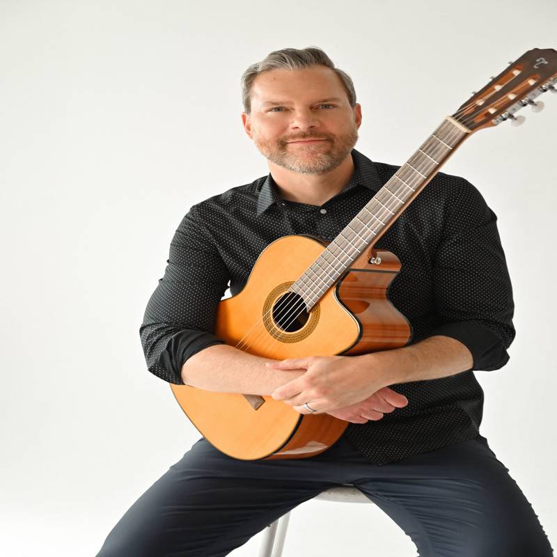 Folk Singer Songwriter and Guitarist